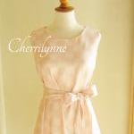 Sleeveless Tent Dress With Sash In Pale Peach..