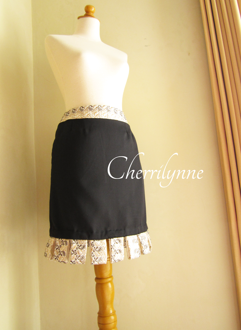 Black Skirt With Loops Detail At The Hem